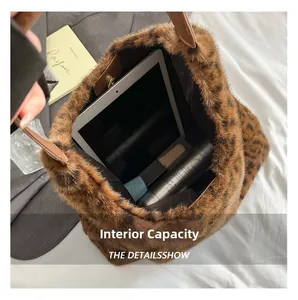 Macro shot showing internal capacity of plush leopard print tote bag with brown handles