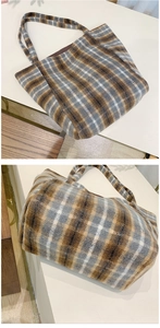 Detail of wool blend plaid tote bag with soft texture and vintage checkered pattern