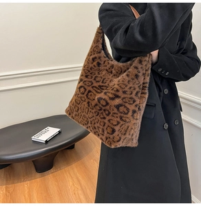 Close-up of leopard print faux fur tote bag with a premium leather shoulder strap