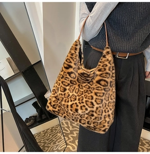 Detail of faux mink leopard print tote bag with soft plush texture and leather strap