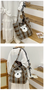 Detailed view of vintage plaid tote bag featuring a cute plush dog patch and thick fabric