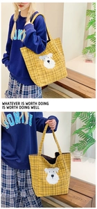 Detail of yellow plaid tote bag featuring a cute white schnauzer applique and wide strap
