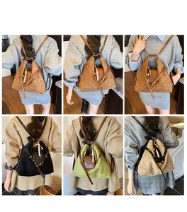 Mannequin portant le sac à dos vintage en daim avec détails de sangles polyvalentes