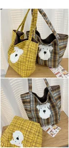 Detail showing two plaid tote bags with cute white plush puppy embroidery and retro check patterns