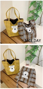 Detail of wool plaid tote bags with cute 3D puppy embroidery in yellow and brown