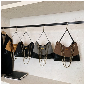 Detailed display of vintage patchwork handbags with gold chains and diamond quilting
