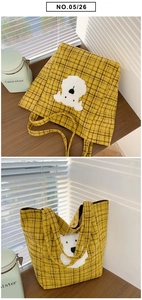 Detail of yellow plaid tote bag featuring a cute white plush puppy patch embroidery