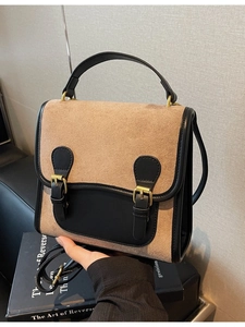 Vintage khaki frosted backpack with black leather trim and gold buckle accents