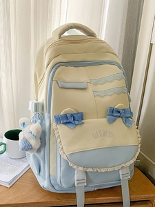 Pastel blue and cream school backpack with lace trim and cute bunny charm accessory