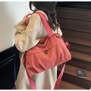 Coral pink large capacity canvas tote bag with wide strap for commuting and daily use