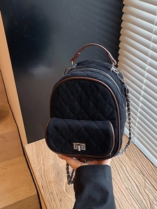 Chic quilted black velvet mini backpack with brown leather trim and chain straps