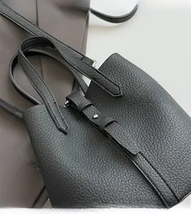 Detailed close-up of premium black lychee pattern leather and durable stitching