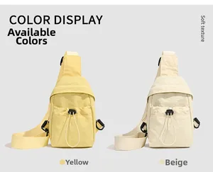 Detail view of nylon crossbody bags in yellow and beige with drawstring pockets