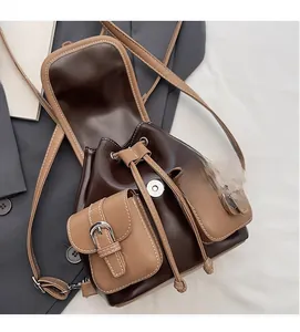 Detail of vintage bicolor faux leather backpack with drawstring and magnetic flap