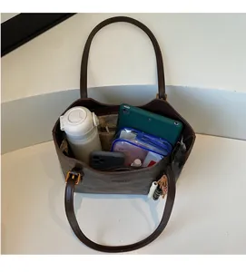 Top view of spacious dark brown tote bag showing multi-pocket storage and large capacity