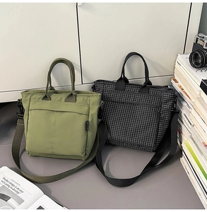 Detail of canvas tote bags with front pockets and adjustable straps for daily use