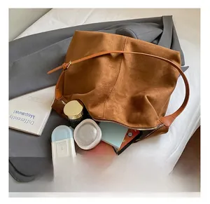 Brown suede tote bag with large capacity showing interior storage space and zipper
