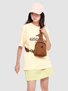 Versatile dark brown nylon crossbody chest bag with adjustable strap and utility pockets