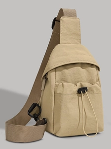 Khaki nylon sling bag with adjustable shoulder strap and drawstring utility pocket