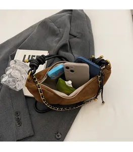 Interior view of brown suede croissant bag showing large capacity for daily essentials