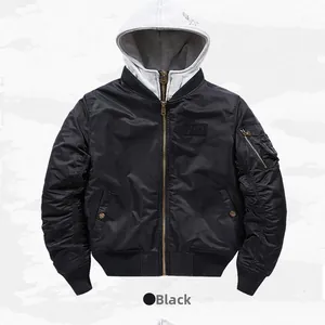 Detail of black bomber jacket featuring gray hood lining and gold metal zipper
