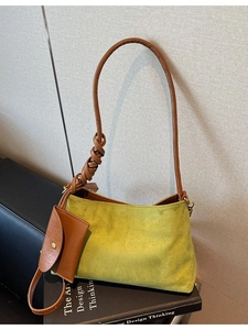 Green suede tote bag with brown knotted leather strap and matching mini pouch charm