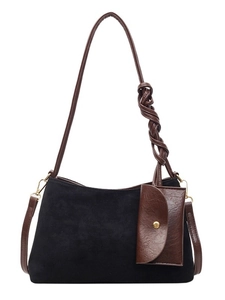 Large black suede tote bag with brown woven strap and matching small leather pouch charm