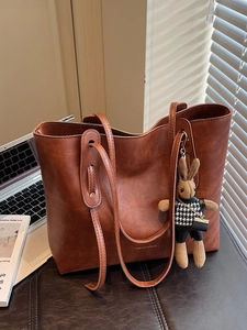 Vintage brown large capacity tote bag with bunny pendant and gold fashion lettering