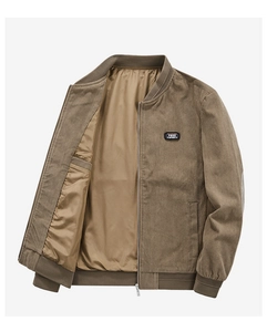 Detailed view of brown corduroy bomber jacket featuring Free Spirit chest patch and zip