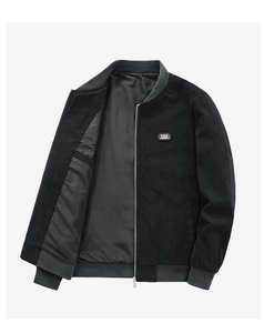 Close-up of black corduroy jacket with Free Spirit patch and grey ribbed collar detail
