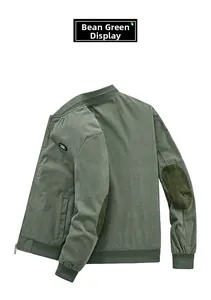 Detail of pea green corduroy jacket with baseball collar and elbow patches
