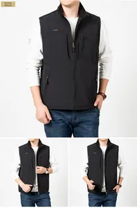 Detail view of black fleece vest featuring vertical chest pocket and brand embroidery