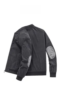 Detail of dark grey corduroy jacket with ribbed cuffs and contrast elbow patches