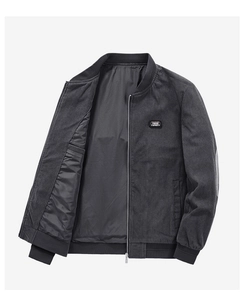 Detail of grey corduroy bomber jacket with ribbed cuffs and Free Spirit embroidered patch