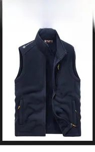 Detail of navy blue fleece vest featuring stand collar, zip pockets, and warm inner lining