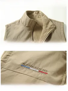 Detail of khaki fleece-lined vest featuring stand collar and striped logo embroidery
