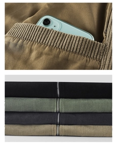 Detail of ribbed texture corduroy jackets with metal zipper and large utility pockets