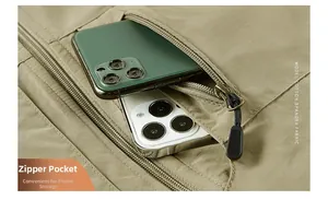Detail view of large zipper pocket on khaki fleece vest holding two mobile phones