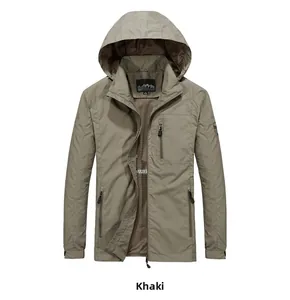 Detailed view of khaki hooded jacket featuring functional zippers and mesh lining