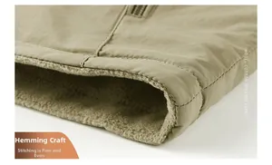 Detail shot of khaki vest hem with sturdy stitching and soft fleece lining texture