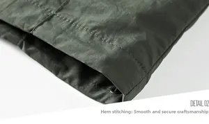 Close-up of jacket hem with reinforced double stitching and adjustable metal eyelet