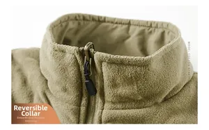 Detail of the stand collar and smooth zipper stitching on a reversible fleece vest