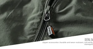 Detail shot of army green casual jacket with black and orange sports zipper slider