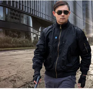 Detail of black tactical pilot jacket showing ribbed cuffs and utility arm pocket