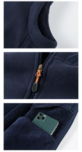 Detail of dark blue fleece vest with stand collar, durable zipper and large side pocket