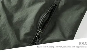 Detail of a deep olive green outdoor jacket featuring a smooth anti-theft zipper pocket