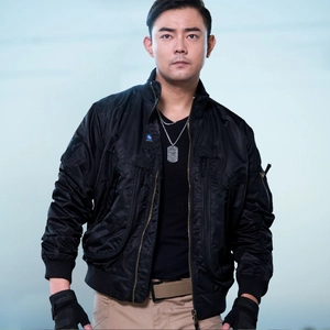 Men's black MA-1 bomber jacket with tactical patches and ribbed cuffs in a sleek outdoor shot