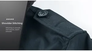 Close-up of shoulder epaulette detail with button and reinforced stitching on jacket