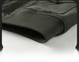 Close-up of the elastic ribbed hem of a heavy duty winter jacket in olive green