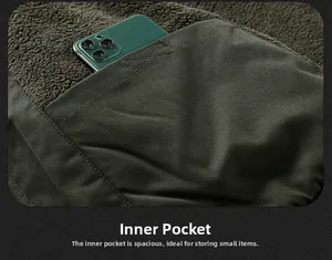Detailed view of deep interior pocket with green fleece lining on warm winter parka jacket